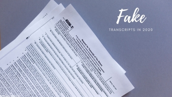 A stack of fake transcripts on a table.