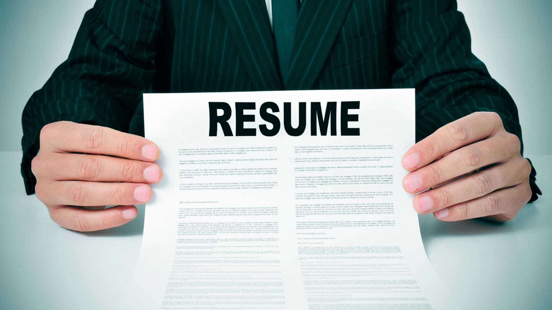 holding a job applicant's resume in your hands