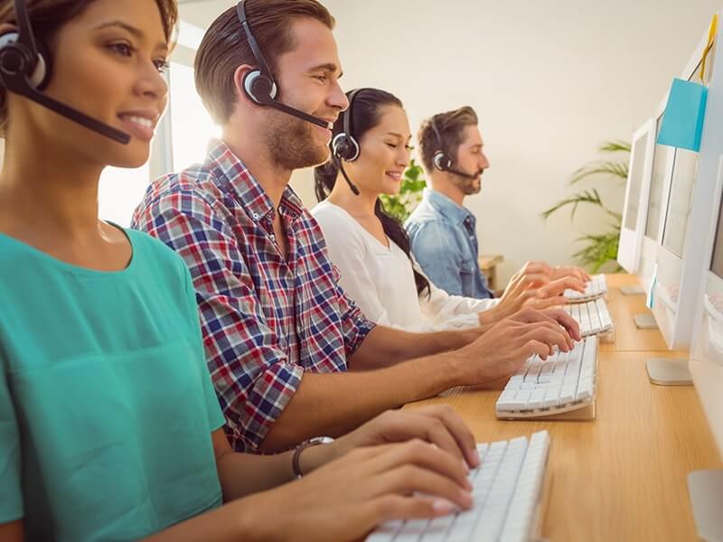 Customer support agents assisting clients